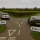 Asset sale vs share sale illustrated by a photorealistic UK countryside Y-junction, with road signs on grass verges reading “Asset Sale” to the left and “Share Sale” to the right. A silver Ford Focus turns left towards Asset Sale, while a dark grey Aston Martin sports car takes the right fork towards Share Sale, with UK road markings and hedgerows under an overcast sky.